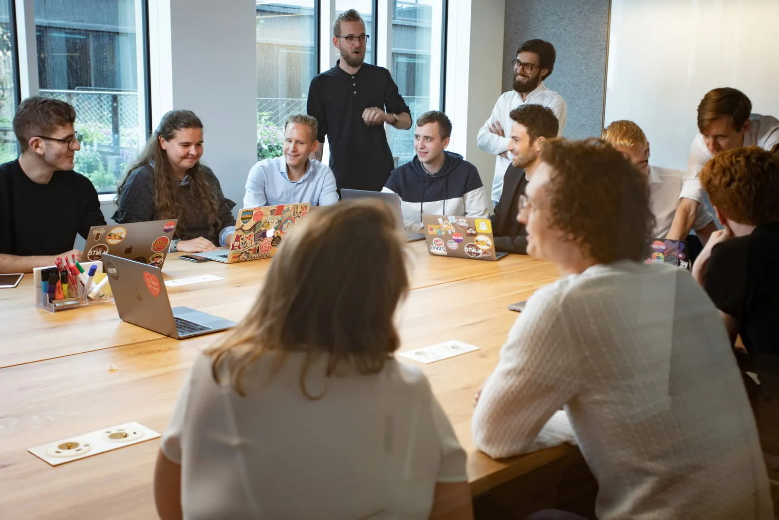 Diverse professionals collaborating in a modern meeting setting
