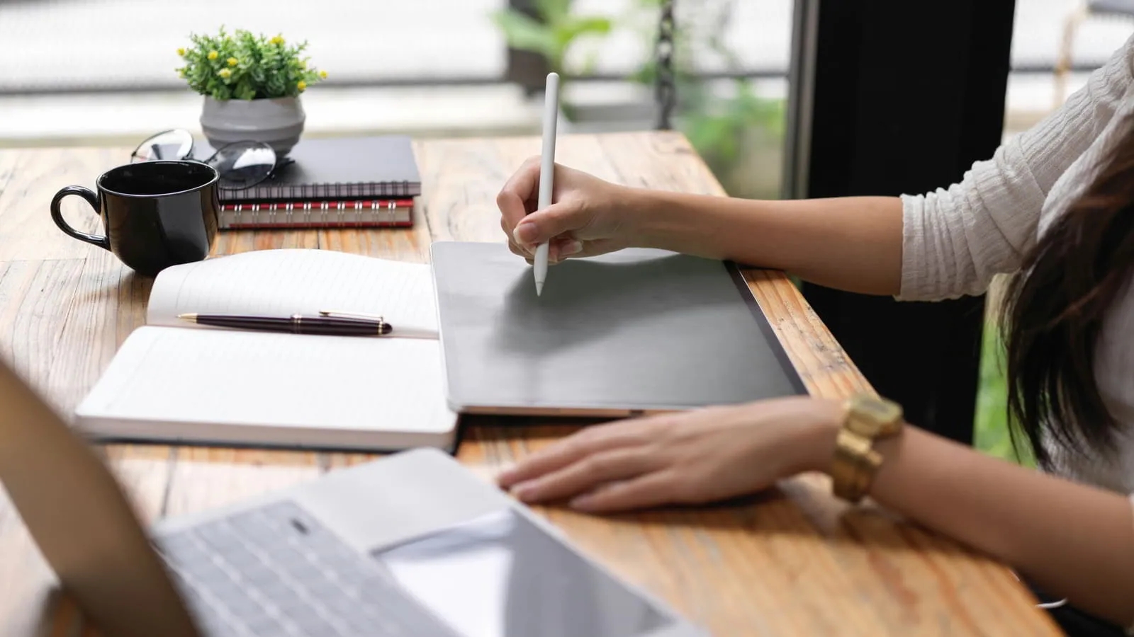 Research documents and notebook on a professional desk