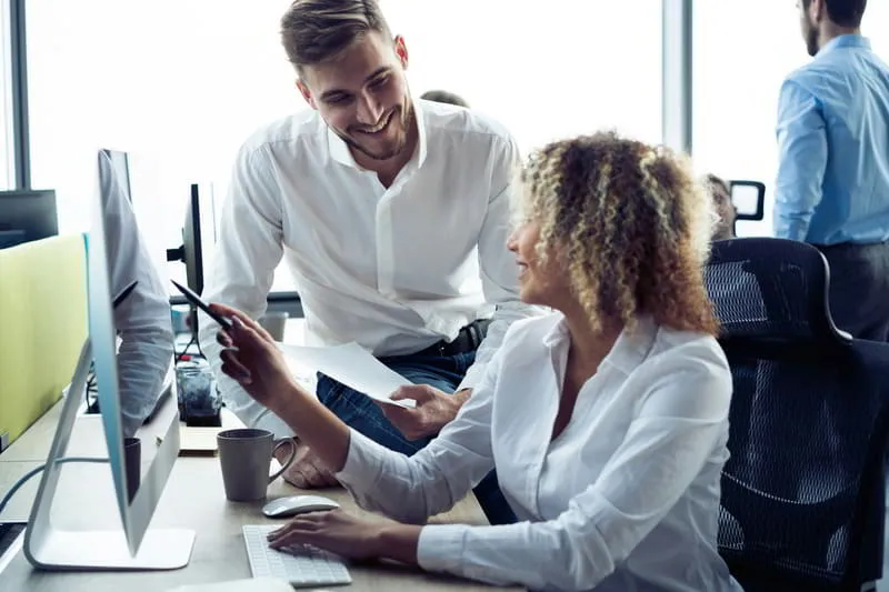 Technology professionals collaborating in a modern workplace